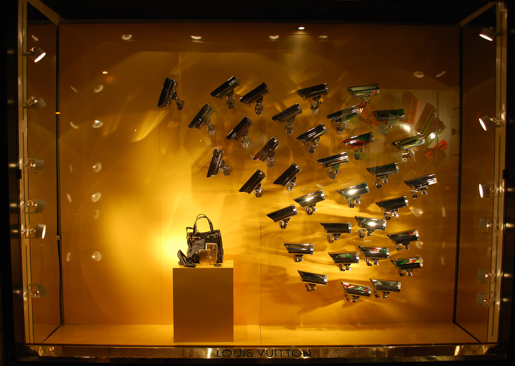 LV,  in a shop window at the Louis Vuitton store in the …